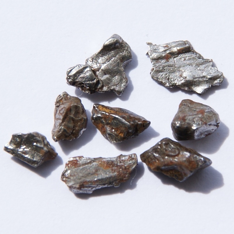 Iron — Fragments of an iron meteorite, about 92% iron. Original size of the single pieces in cm: 0.4 - 0.8