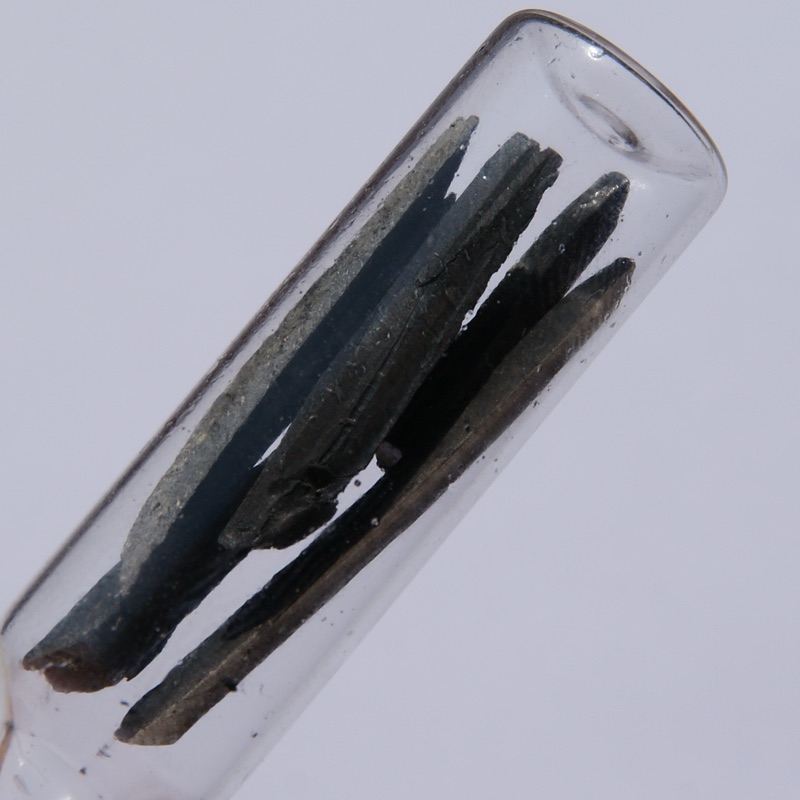 Lithium — 0.5 Grams Lithium under Argon. Original size of the largest piece in cm: 0.3 x 4