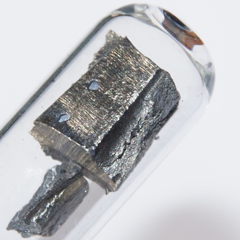 Neodymium — Ultrapure Neodymium under Argon, 5 grams. Original length of the large piece in cm: 1