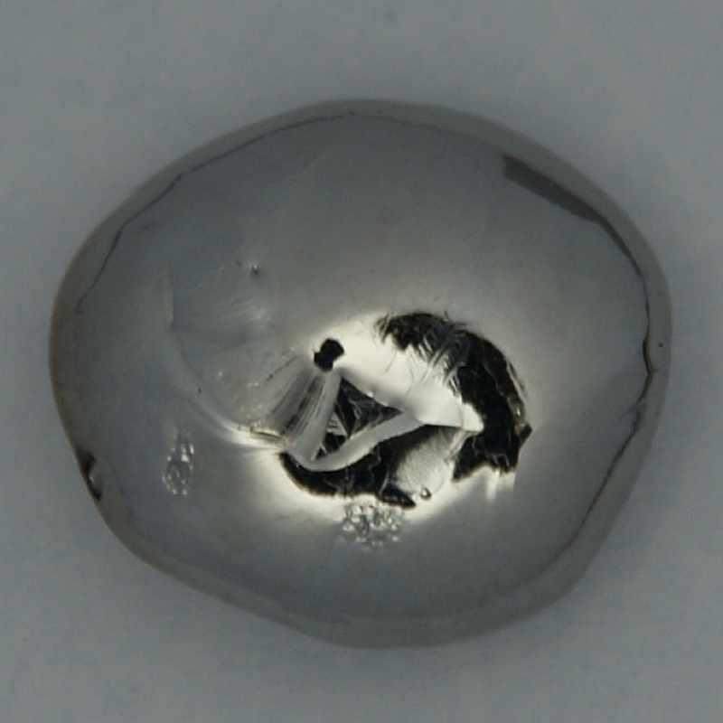 Rhenium — Pure Rhenium Bead, arc melted, 21 grams. Original size in cm: 1.5 x 1.7. Measured radiation dose <0.05 μS/h.